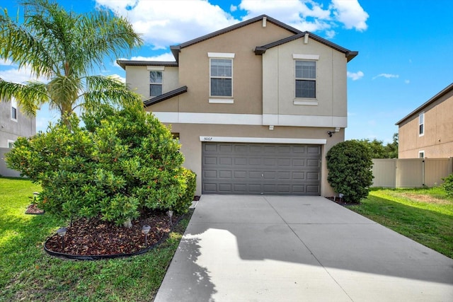 5067 Sable Chime Dr, Wimauma, FL 33598 - view of front facade featuring stucco siding, concrete driveway, and an attached garage