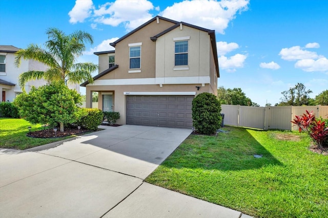 5067 Sable Chime Dr, Wimauma, FL 33598 - view of front of home with stucco siding, an attached garage, and concrete driveway