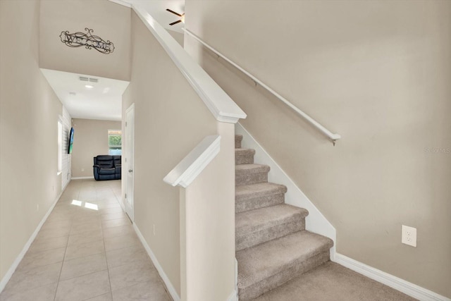 5067 Sable Chime Dr, Wimauma, FL 33598 - stairway with tile patterned floors and baseboards