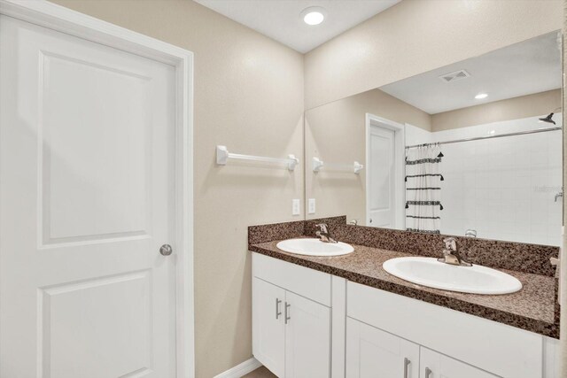 5067 Sable Chime Dr, Wimauma, FL 33598 - full bathroom featuring tiled shower and double vanity