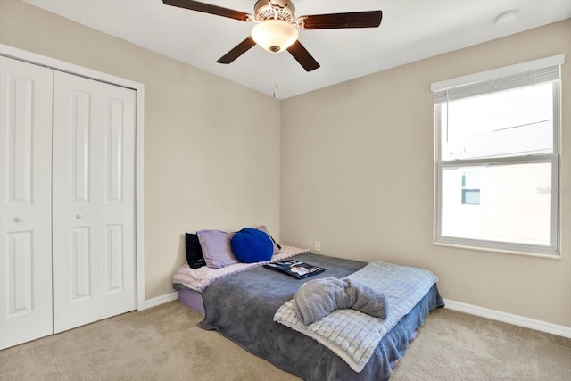 5067 Sable Chime Dr, Wimauma, FL 33598 - carpeted bedroom with baseboards, a closet, and a ceiling fan