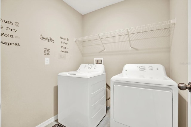 5067 Sable Chime Dr, Wimauma, FL 33598 - washroom featuring separate washer and dryer and baseboards