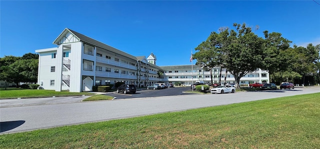 view of property with uncovered parking