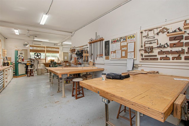 dining area with a workshop area and concrete flooring