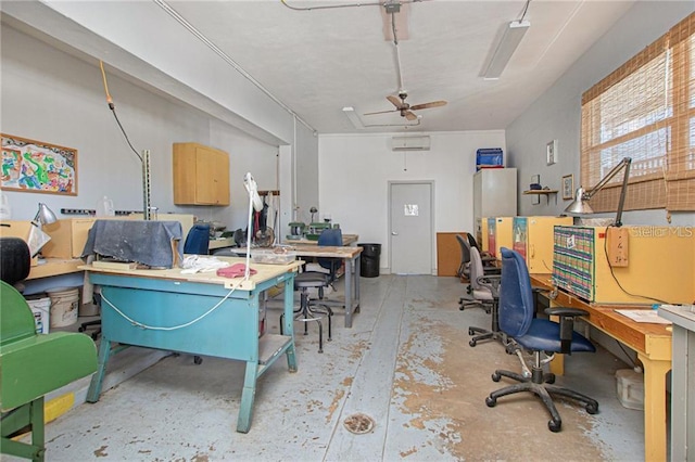 home office featuring concrete floors, a workshop area, a wall mounted air conditioner, and attic access