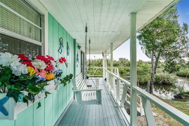 2220 S Coon Pt, Crystal River, FL 34429 - deck featuring covered porch and a water view