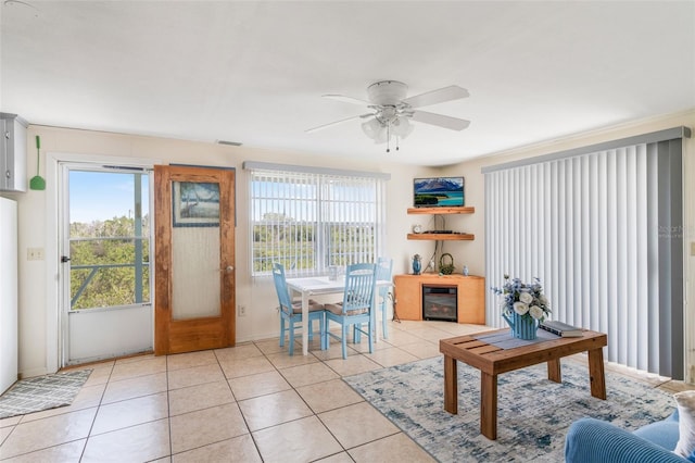 2220 S Coon Pt, Crystal River, FL 34429 - living room featuring light tile patterned flooring, a ceiling fan, beverage cooler, and baseboards