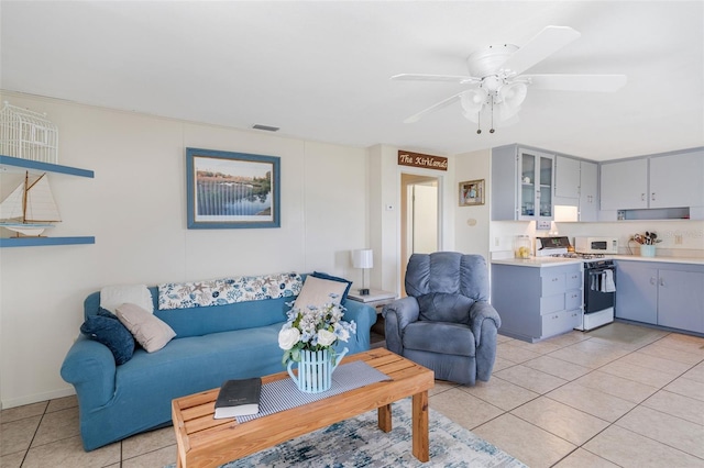 2220 S Coon Pt, Crystal River, FL 34429 - living area featuring light tile patterned flooring and ceiling fan