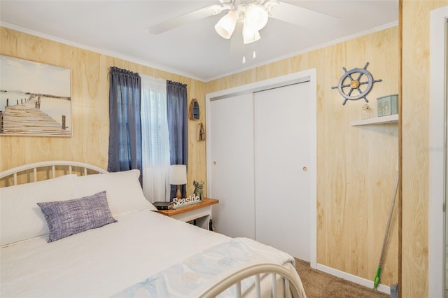 2220 S Coon Pt, Crystal River, FL 34429 - bedroom with carpet flooring, a closet, wood walls, and ceiling fan