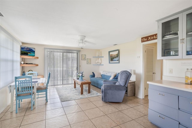 2220 S Coon Pt, Crystal River, FL 34429 - living room with ceiling fan and light tile patterned flooring