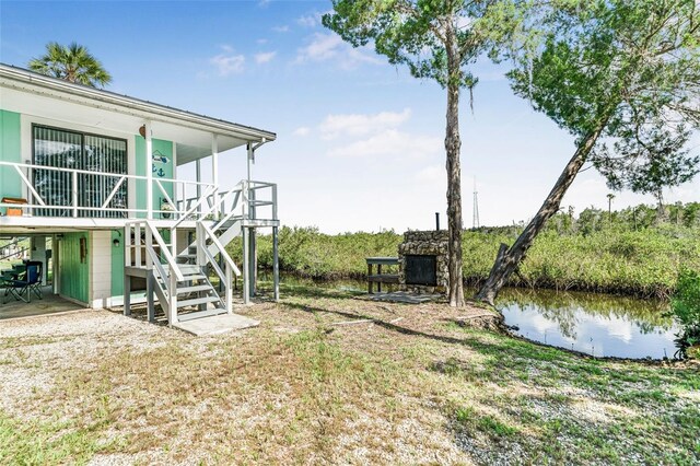 2220 S Coon Pt, Crystal River, FL 34429 - view of yard with stairs and a water view
