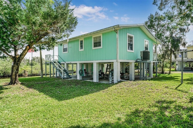 2220 S Coon Pt, Crystal River, FL 34429 - back of house featuring stairway, central air condition unit, a yard, and a patio