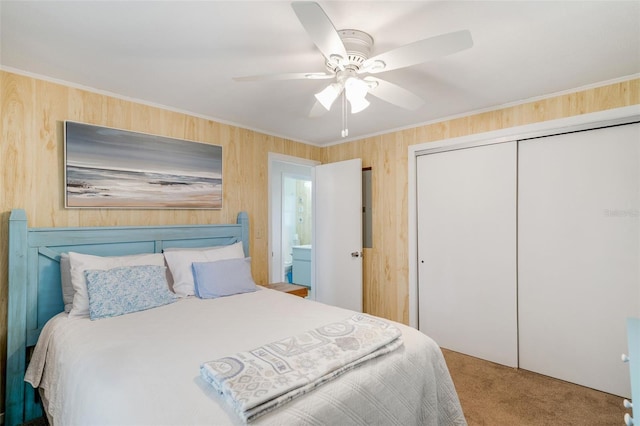 2220 S Coon Pt, Crystal River, FL 34429 - carpeted bedroom with a closet, wooden walls, ceiling fan, and crown molding