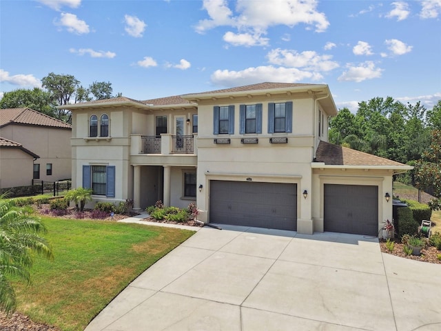 view of front facade featuring a balcony, stucco siding, driveway, and a front lawn