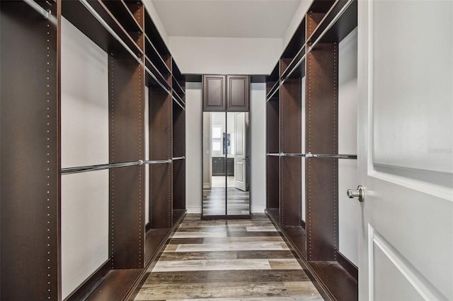 spacious closet with wood finished floors