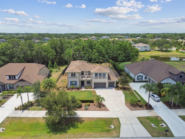 aerial perspective of suburban area with a large body of water
