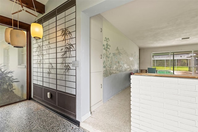 1675 Robin Hood Ln, Clearwater, FL 33764 - hall with speckled floor and baseboards