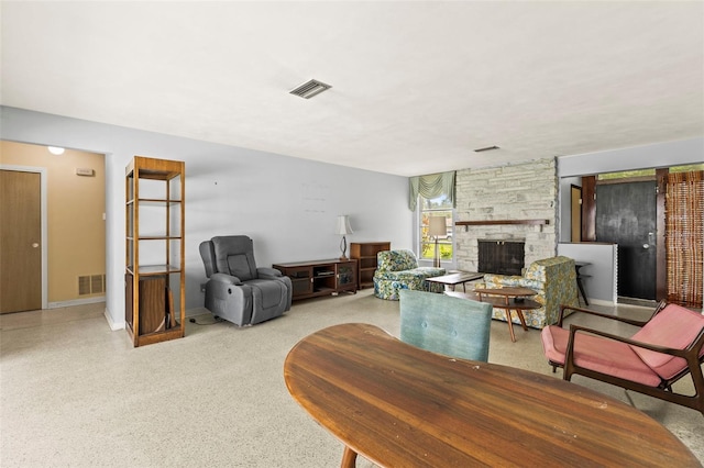 1675 Robin Hood Ln, Clearwater, FL 33764 - living area featuring a stone fireplace and baseboards