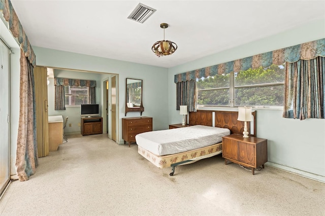 1675 Robin Hood Ln, Clearwater, FL 33764 - bedroom featuring speckled floor and connected bathroom