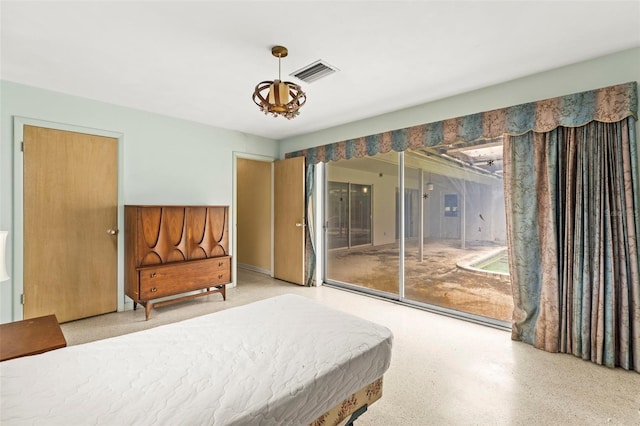 1675 Robin Hood Ln, Clearwater, FL 33764 - bedroom with access to outside and speckle patterned floor