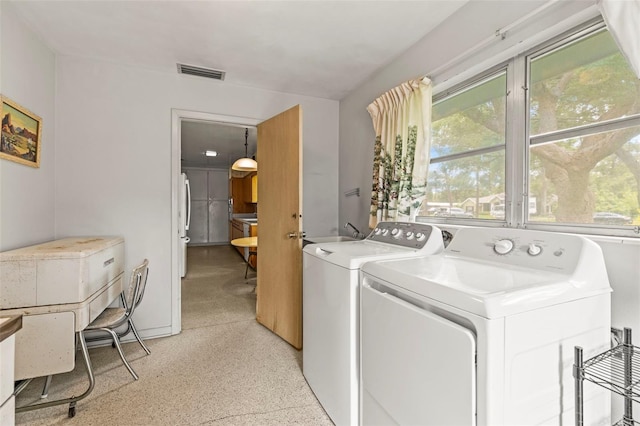 1675 Robin Hood Ln, Clearwater, FL 33764 - laundry area with independent washer and dryer