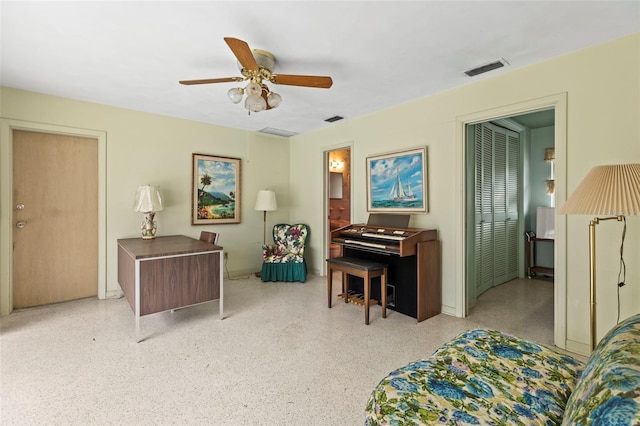 1675 Robin Hood Ln, Clearwater, FL 33764 - sitting room featuring ceiling fan, baseboards, and speckled floor
