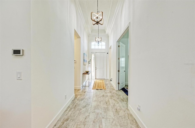 15525 Corona Del Mar Dr, Wimauma, FL 33598 - hall with a chandelier, crown molding, and baseboards