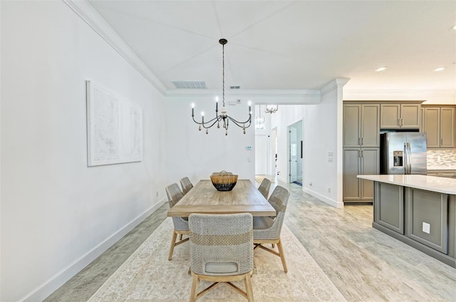 15525 Corona Del Mar Dr, Wimauma, FL 33598 - dining room with a chandelier, baseboards, crown molding, and light wood-style floors