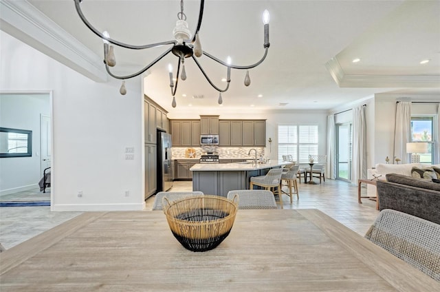 15525 Corona Del Mar Dr, Wimauma, FL 33598 - dining area featuring ornamental molding, healthy amount of natural light, baseboards, and recessed lighting
