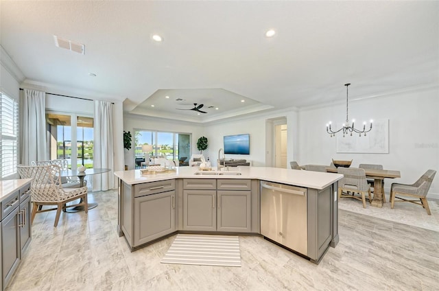 15525 Corona Del Mar Dr, Wimauma, FL 33598 - kitchen featuring stainless steel dishwasher, a sink, gray cabinets, crown molding, and light countertops