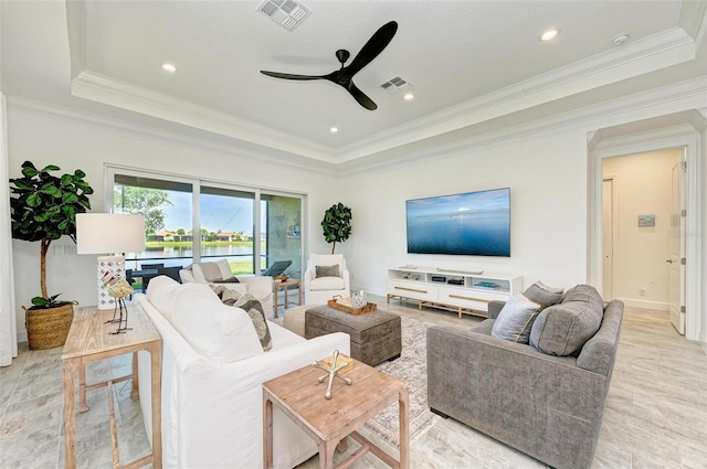 15525 Corona Del Mar Dr, Wimauma, FL 33598 - living area with a tray ceiling, a ceiling fan, ornamental molding, baseboards, and recessed lighting