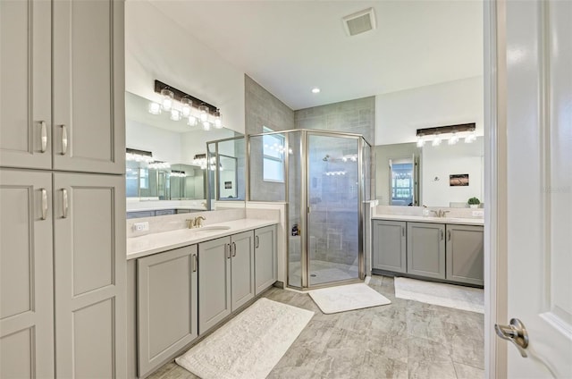 15525 Corona Del Mar Dr, Wimauma, FL 33598 - bathroom featuring a shower stall and two vanities