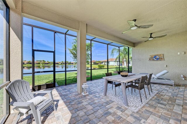 15525 Corona Del Mar Dr, Wimauma, FL 33598 - sunroom featuring a water view, a ceiling fan, and outdoor dining area