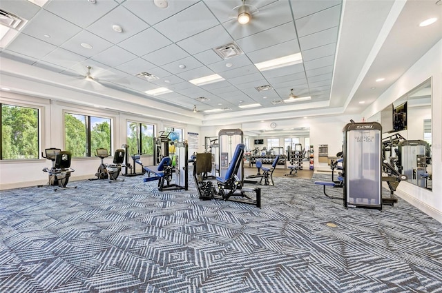15525 Corona Del Mar Dr, Wimauma, FL 33598 - gym with carpet flooring, baseboards, a raised ceiling, and a ceiling fan