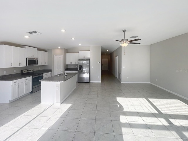 11524 Sage Canyon Dr, Riverview, FL 33578 - kitchen featuring stainless steel appliances, a sink, white cabinetry, open floor plan, and ceiling fan