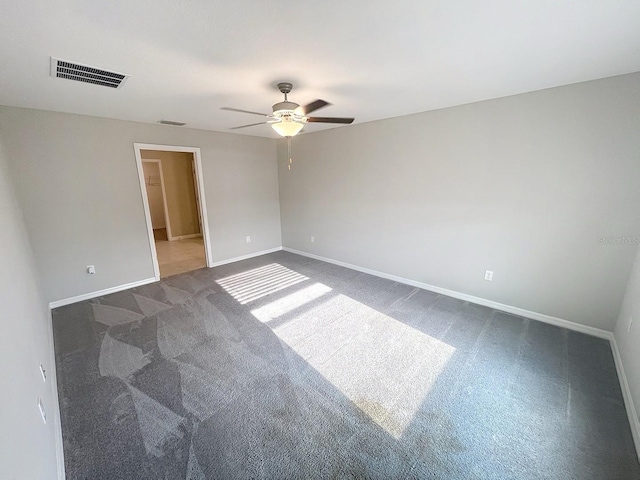 11524 Sage Canyon Dr, Riverview, FL 33578 - empty room with dark carpet, ceiling fan, and baseboards