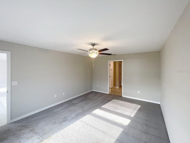 11524 Sage Canyon Dr, Riverview, FL 33578 - spare room with dark carpet, ceiling fan, and baseboards