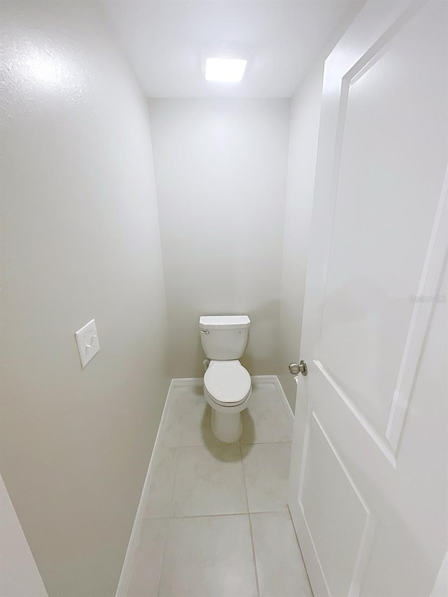 11524 Sage Canyon Dr, Riverview, FL 33578 - bathroom with baseboards, toilet, and tile patterned floors