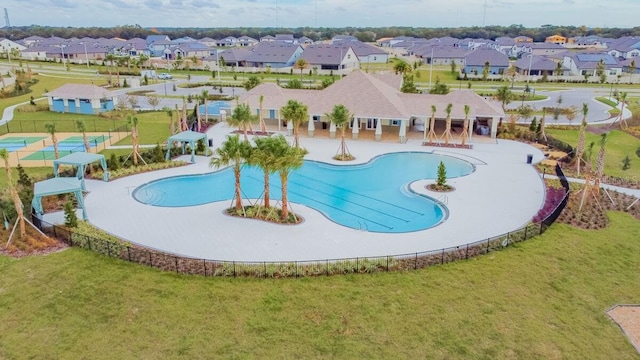11524 Sage Canyon Dr, Riverview, FL 33578 - community pool featuring a residential view and a lawn