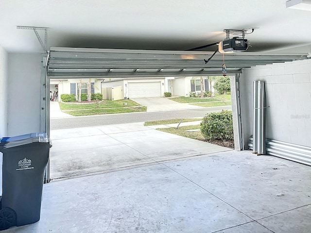 11524 Sage Canyon Dr, Riverview, FL 33578 - garage with a garage door opener and concrete block wall