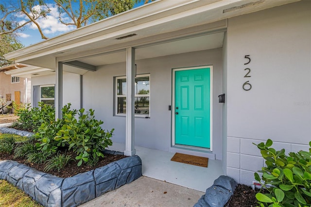 526 62nd Ave NE, Saint Petersburg, FL 33702 - view of exterior entry featuring stucco siding