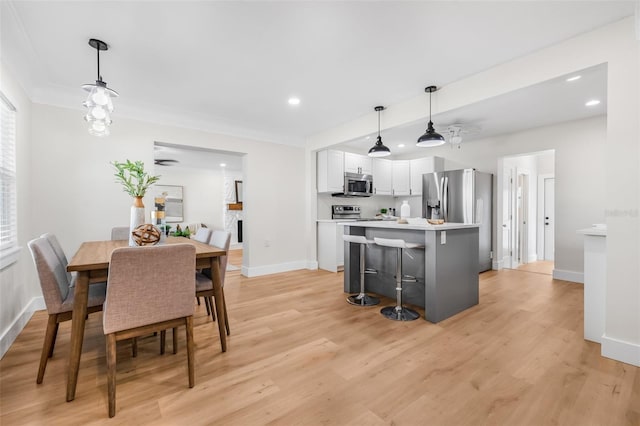 526 62nd Ave NE, Saint Petersburg, FL 33702 - dining room with baseboards, recessed lighting, and light wood-style floors
