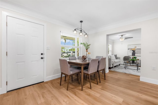 526 62nd Ave NE, Saint Petersburg, FL 33702 - dining area featuring light wood finished floors, baseboards, ornamental molding, and a ceiling fan