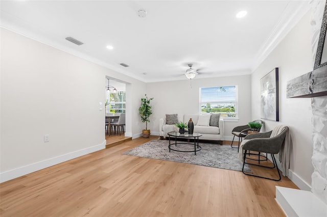 526 62nd Ave NE, Saint Petersburg, FL 33702 - living room with crown molding, light wood-style floors, a ceiling fan, baseboards, and recessed lighting