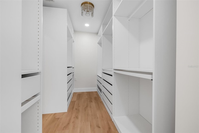 526 62nd Ave NE, Saint Petersburg, FL 33702 - walk in closet with light wood-style floors
