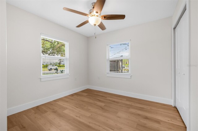 526 62nd Ave NE, Saint Petersburg, FL 33702 - unfurnished bedroom with a closet, light wood-style floors, and baseboards