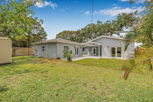 526 62nd Ave NE, Saint Petersburg, FL 33702 - rear view of house with stucco siding and a patio area