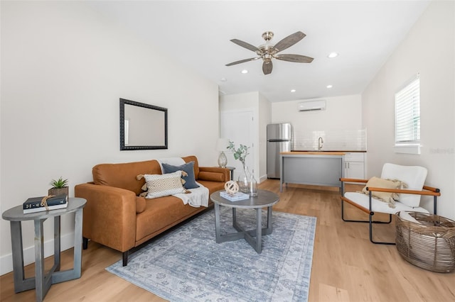 526 62nd Ave NE, Saint Petersburg, FL 33702 - living area featuring a wall unit AC, light wood finished floors, ceiling fan, recessed lighting, and baseboards
