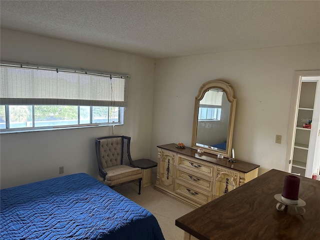 1200 37th St N Unit 403, Saint Petersburg, FL 33713 - bedroom with multiple windows, light colored carpet, and a textured ceiling