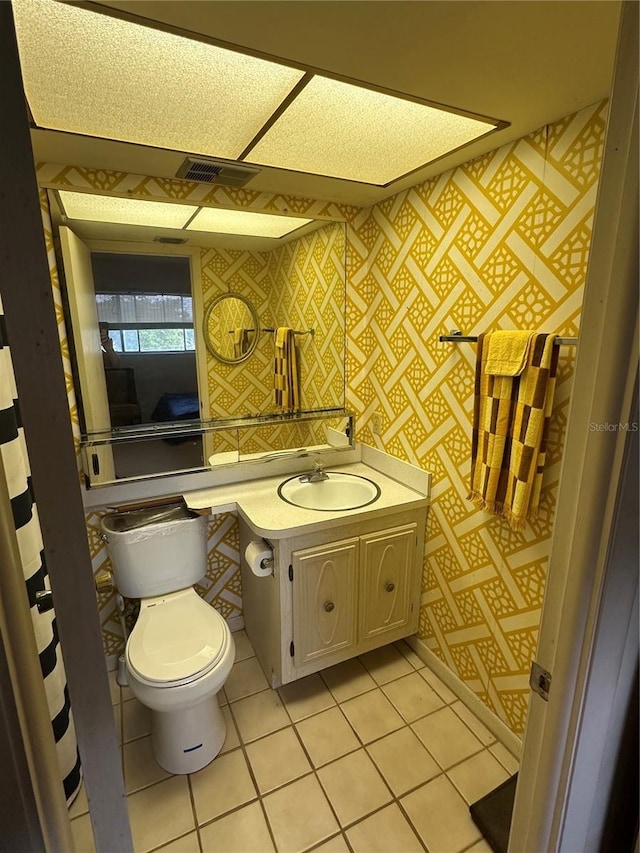 1200 37th St N Unit 403, Saint Petersburg, FL 33713 - bathroom featuring toilet, vanity, and tile patterned floors